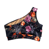Floral-patterned black one shoulder sports bra on a white background